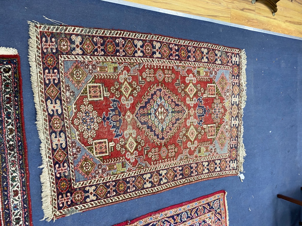 Three North West Persian rugs, largest 180 x 120cm